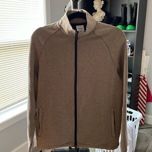 Long sleeve zip up in light beige.